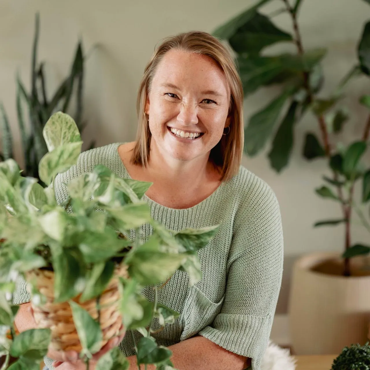 Kelsey Nelson, pictured with plants